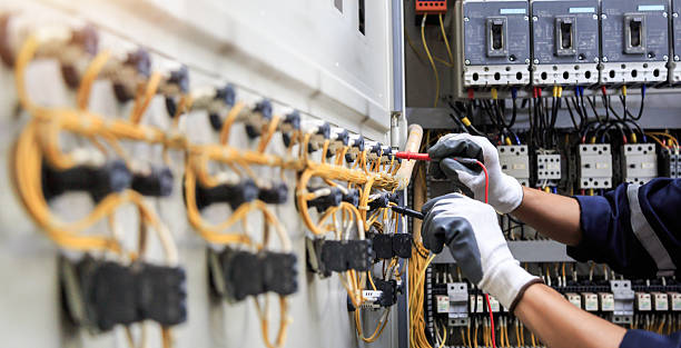 Professional Electrician technician working in Hampton Manor, NY